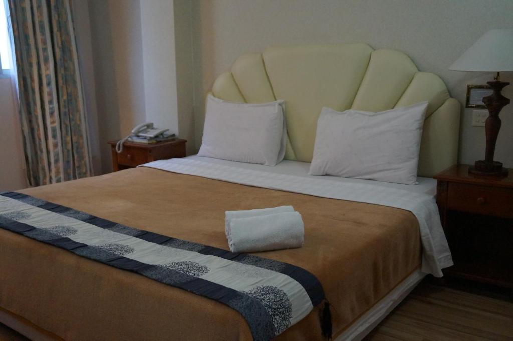 Postel nebo postele na pokoji v ubytování Jeruton Hotel
