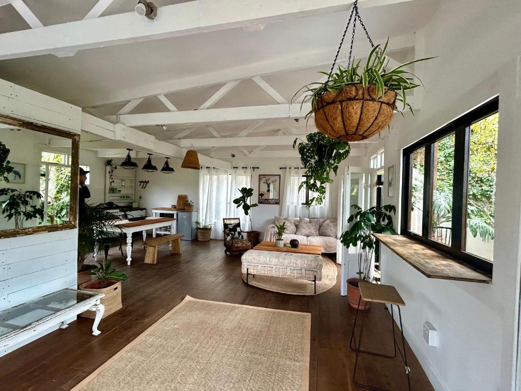 a living room with a couch and a table at Urban Plett in Plettenberg Bay