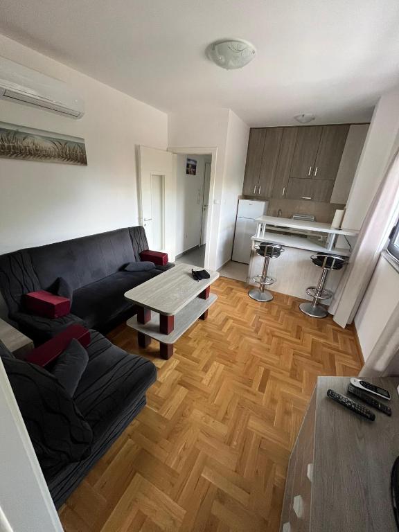 a living room with a couch and a table at Kosmaj in Trebinje
