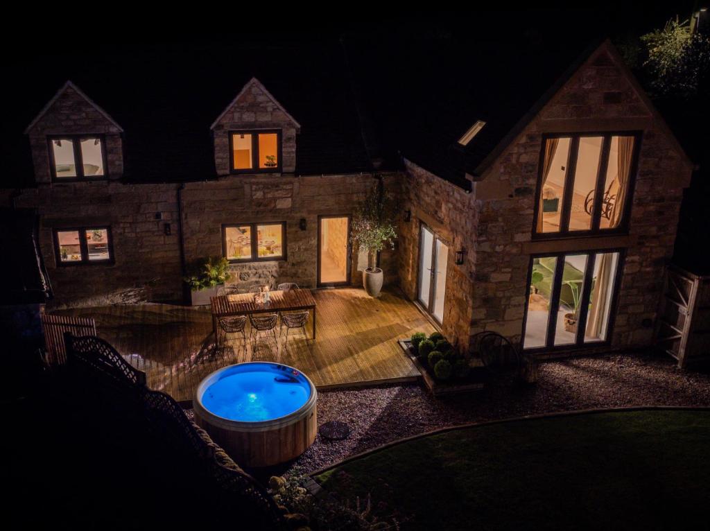 an aerial view of a house with a hot tub at Luxury Cottage in Peak District near Alton Towers in Stanton