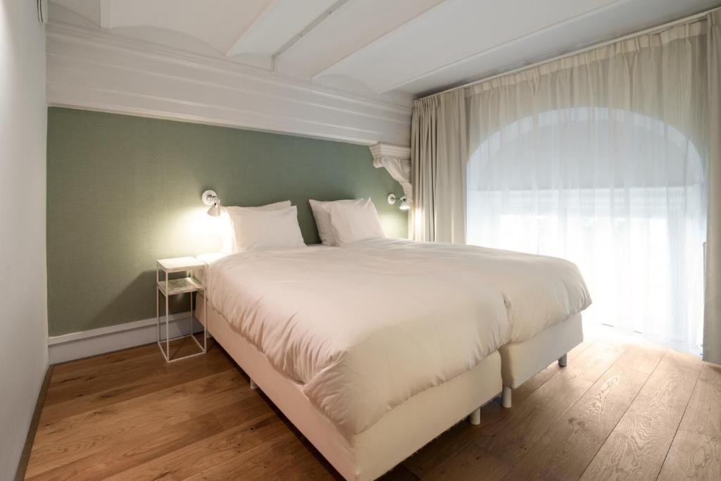 Un ou plusieurs lits dans un hébergement de l'établissement Hotel Arena
