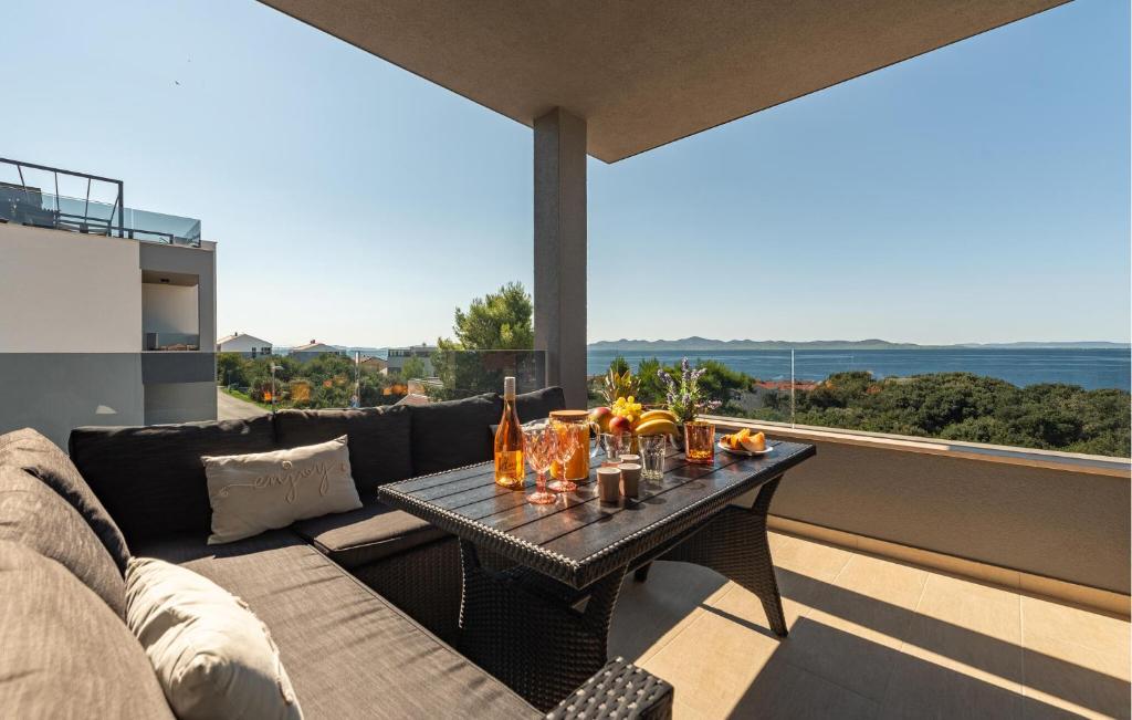 a living room with a couch and a table at 3 Bedroom Awesome Apartment In Kozino in Kožino