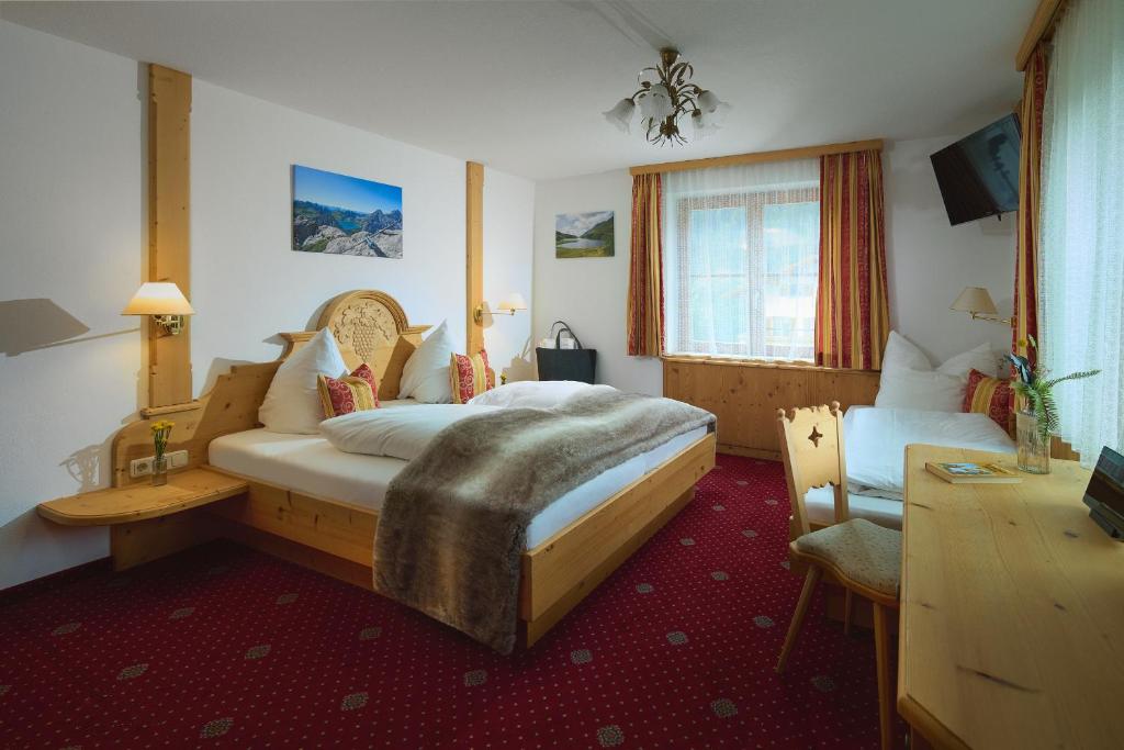 Postel nebo postele na pokoji v ubytování Montafon Moments