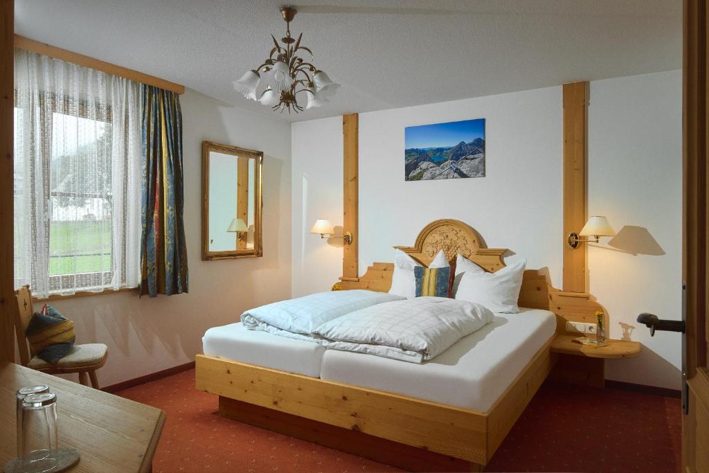 Postel nebo postele na pokoji v ubytování Montafon Moments