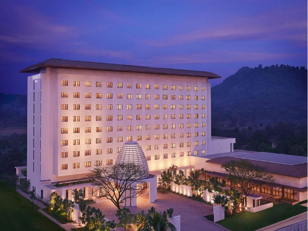 a large white building with a pyramid in front of it at Vivanta Guwahati in Guwahati