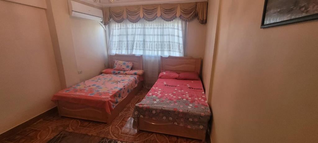 A bed or beds in a room at CozyHome 3BR Place Nasr City