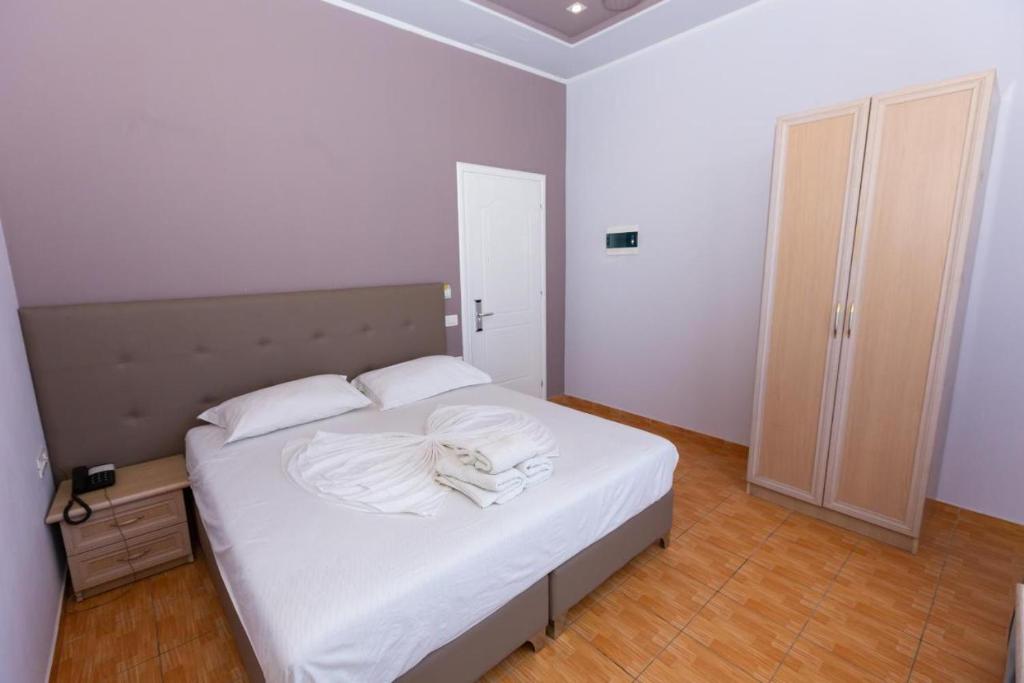 Postel nebo postele na pokoji v ubytování Hotel Triada