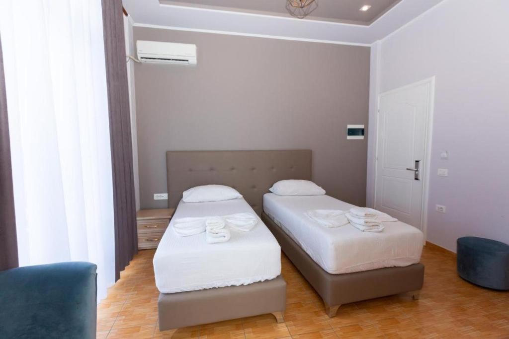 Postel nebo postele na pokoji v ubytování Hotel Triada