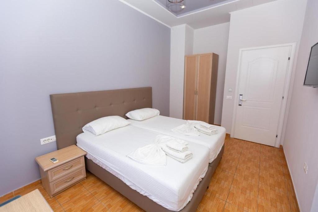 Postel nebo postele na pokoji v ubytování Hotel Triada