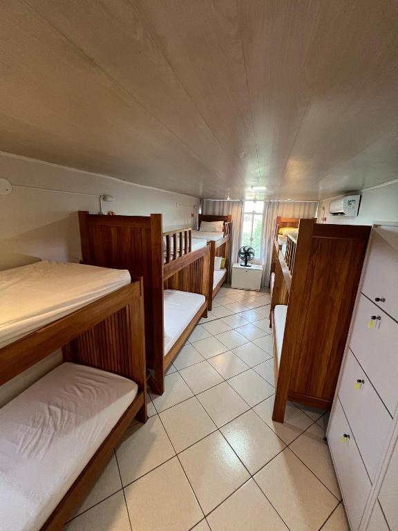 Postel nebo postele na pokoji v ubytování Hostel Da Jô