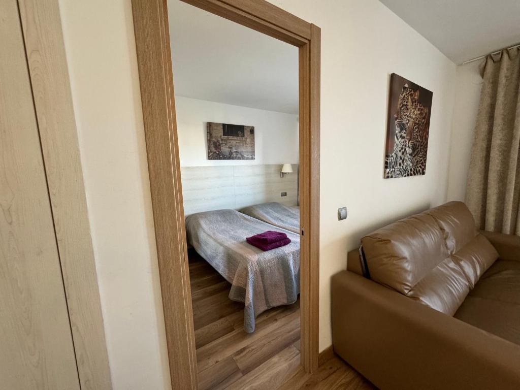 A bed or beds in a room at Apartsalou Michelangelo