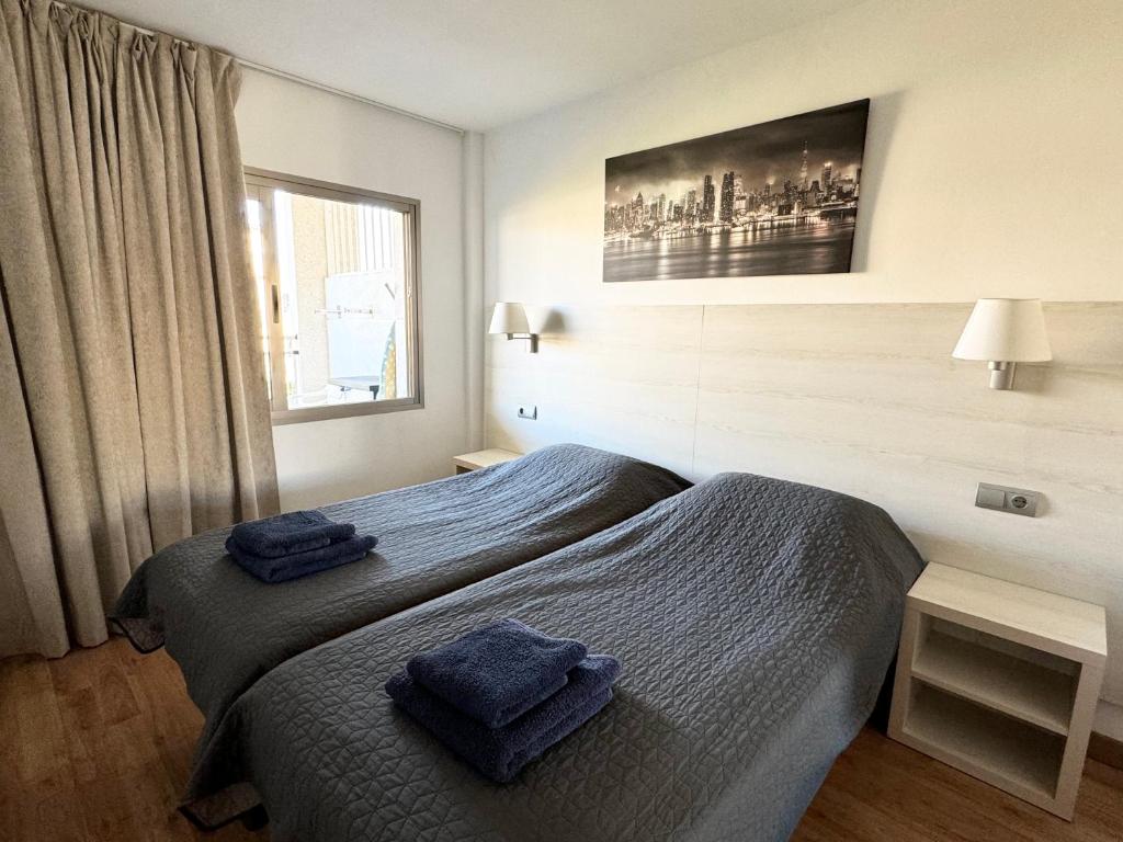 A bed or beds in a room at Apartsalou Michelangelo