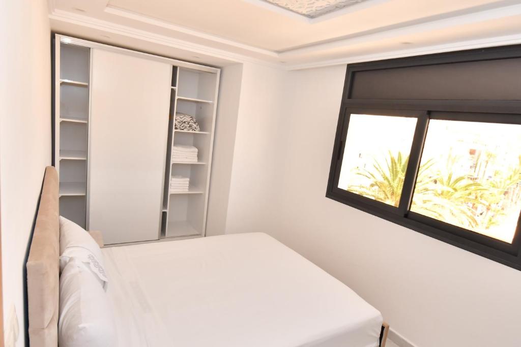Postel nebo postele na pokoji v ubytování Appartement Saloua ino