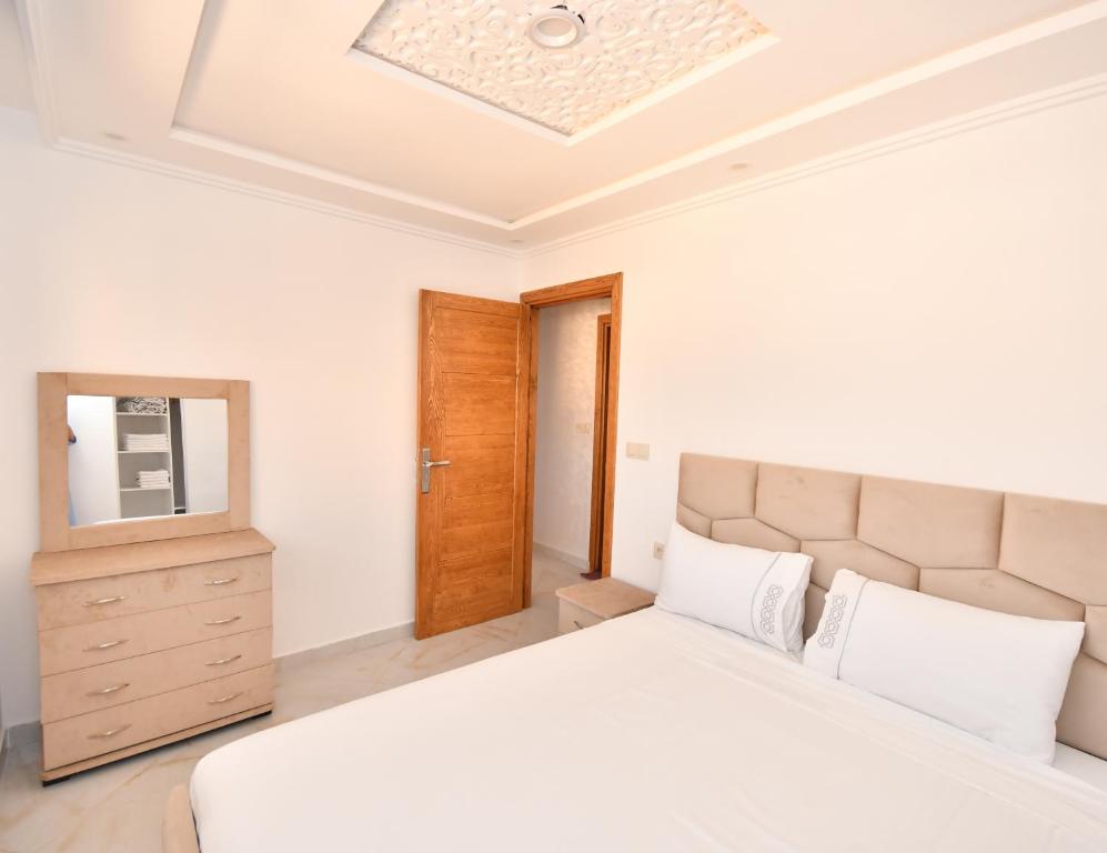Postel nebo postele na pokoji v ubytování Appartement Saloua ino