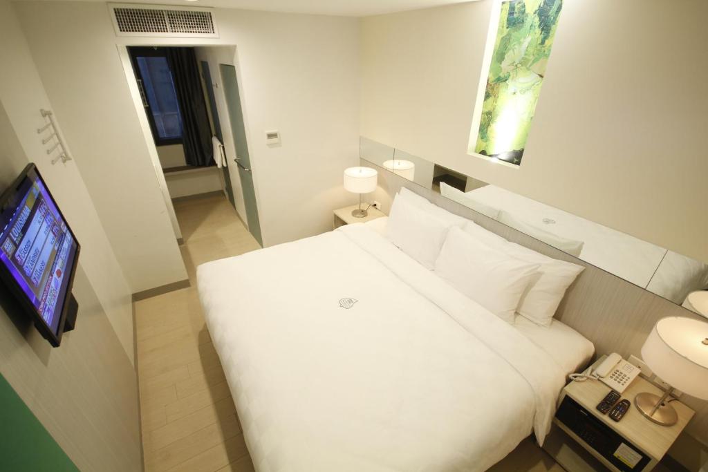 Postel nebo postele na pokoji v ubytování Go Hotels Ortigas Center