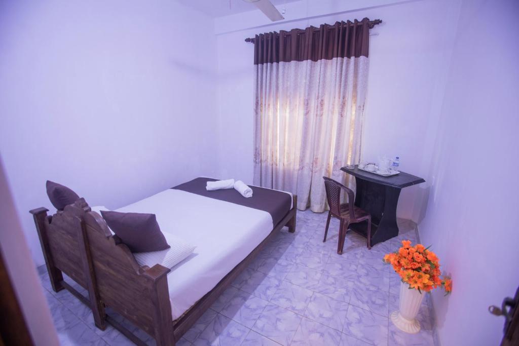 Postel nebo postele na pokoji v ubytování ASNA Homestay