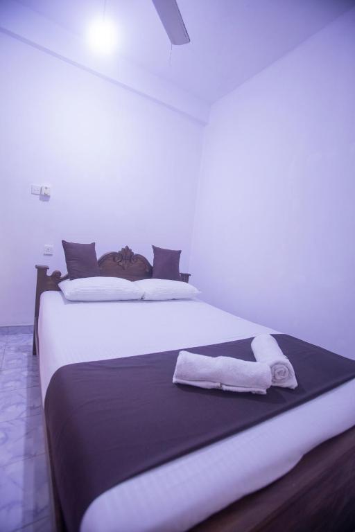 Postel nebo postele na pokoji v ubytování ASNA Homestay