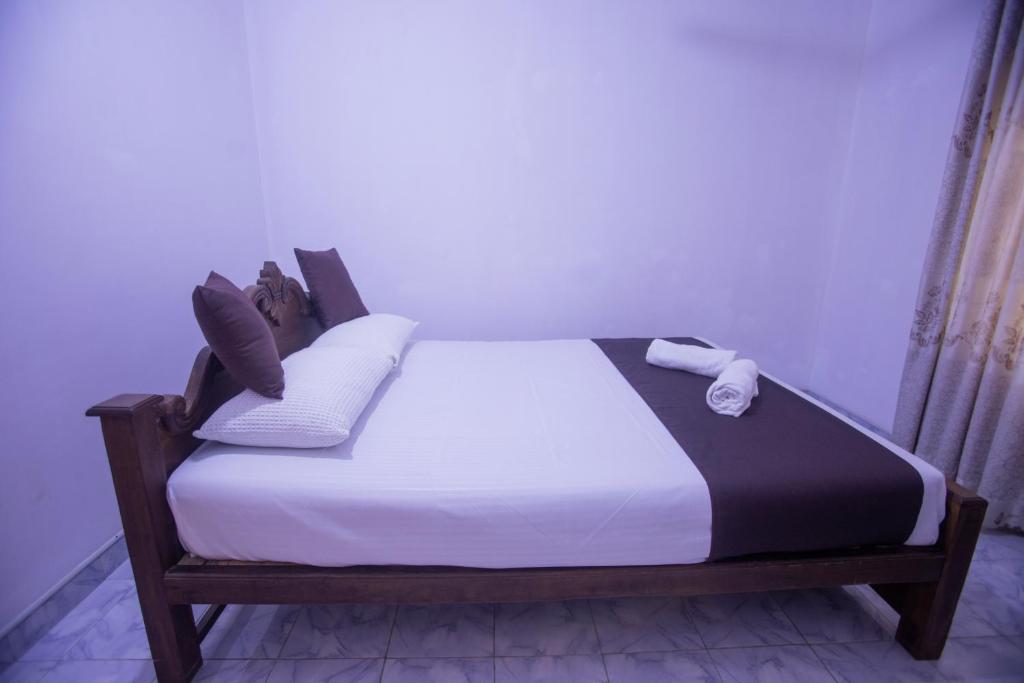 Postel nebo postele na pokoji v ubytování ASNA Homestay