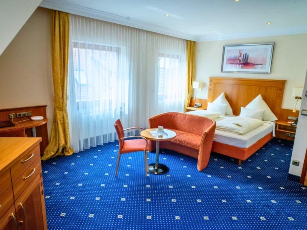 Postel nebo postele na pokoji v ubytování Hotel Lamm