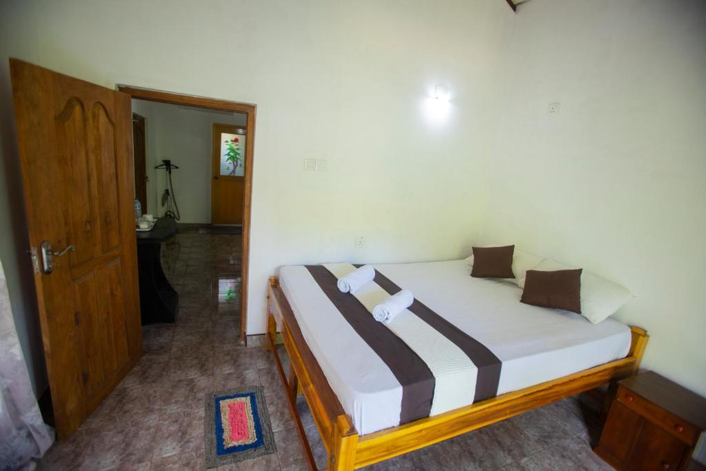 Postel nebo postele na pokoji v ubytování ASNA Homestay
