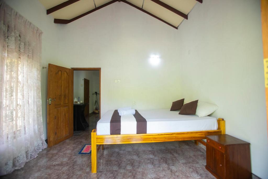 Postel nebo postele na pokoji v ubytování ASNA Homestay