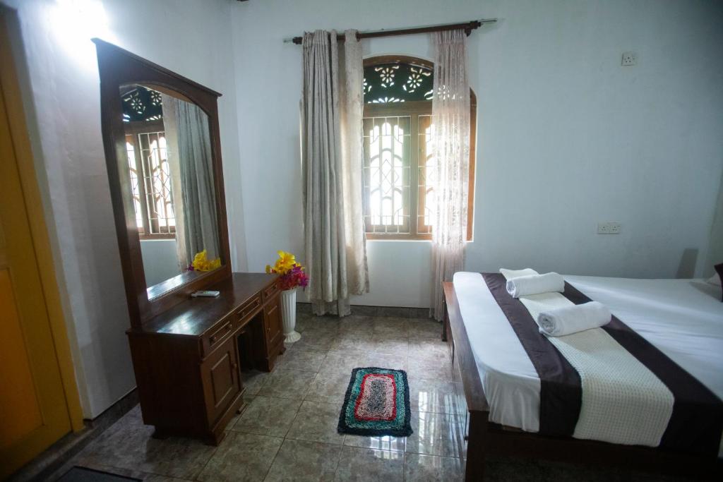 Postel nebo postele na pokoji v ubytování ASNA Homestay