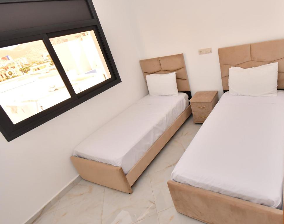 Postel nebo postele na pokoji v ubytování Appartement Riyam