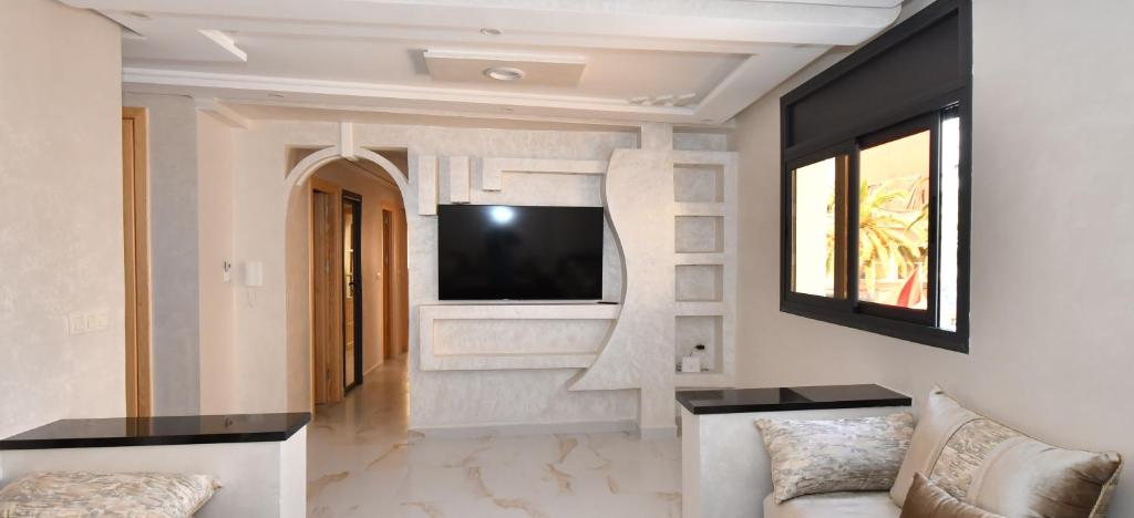 TV a/nebo společenská místnost v ubytování Appartement Riyam