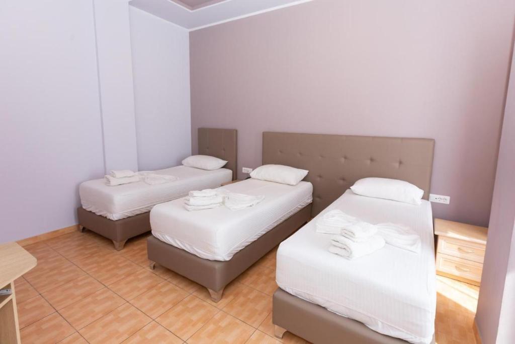 Postel nebo postele na pokoji v ubytování Hotel Triada