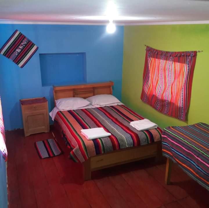 Postel nebo postele na pokoji v ubytování Kactus Lodge - Amantani
