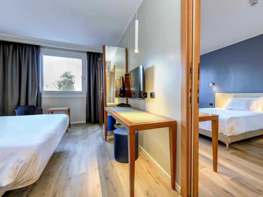 Postel nebo postele na pokoji v ubytování B&B Hotel Quarto d'Altino