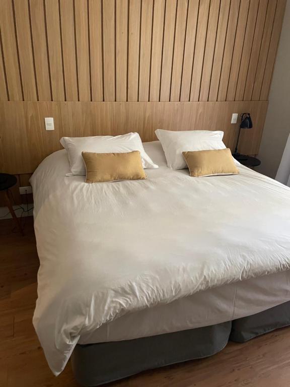 Postel nebo postele na pokoji v ubytování Pousada Telhado de Ouro