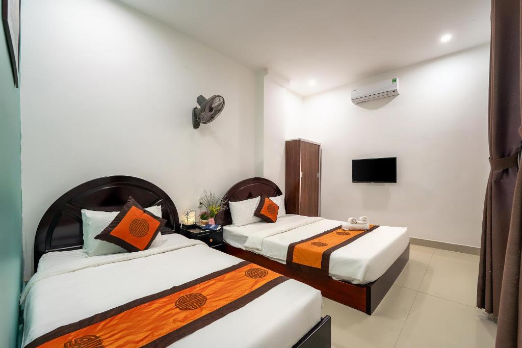 Postel nebo postele na pokoji v ubytování Sam Sam Homestay