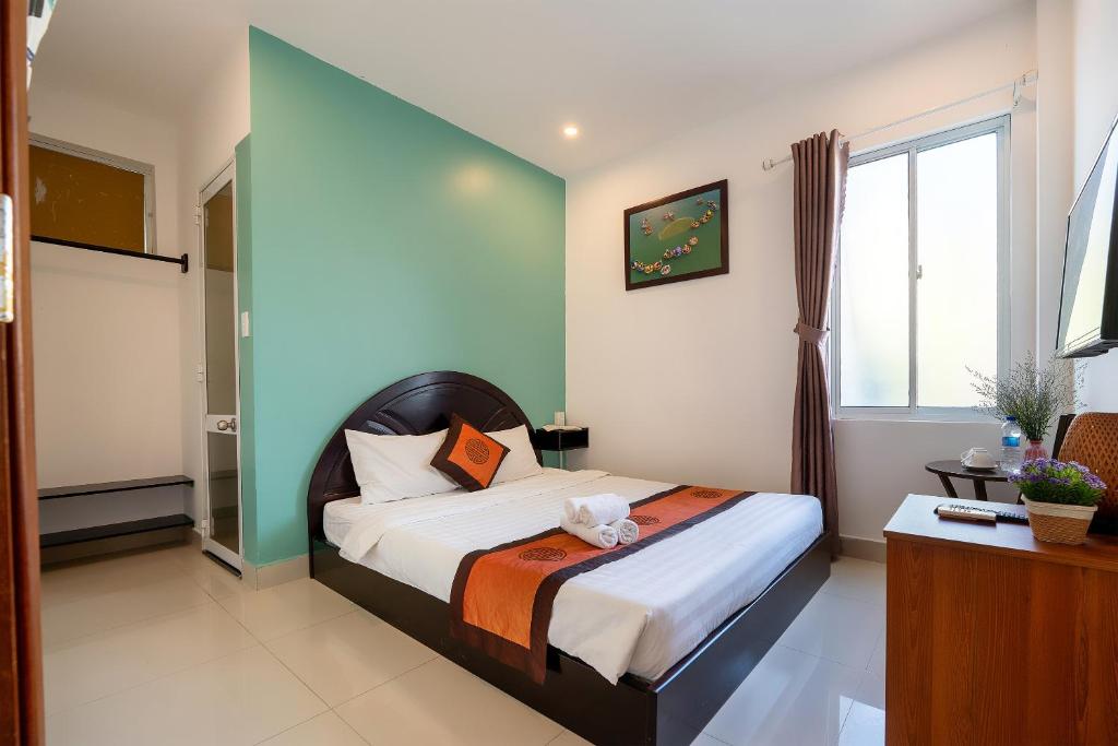 Postel nebo postele na pokoji v ubytování Sam Sam Homestay