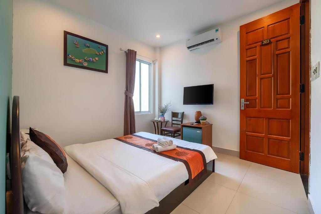 Postel nebo postele na pokoji v ubytování Sam Sam Homestay