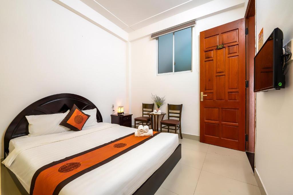 Postel nebo postele na pokoji v ubytování Sam Sam Homestay