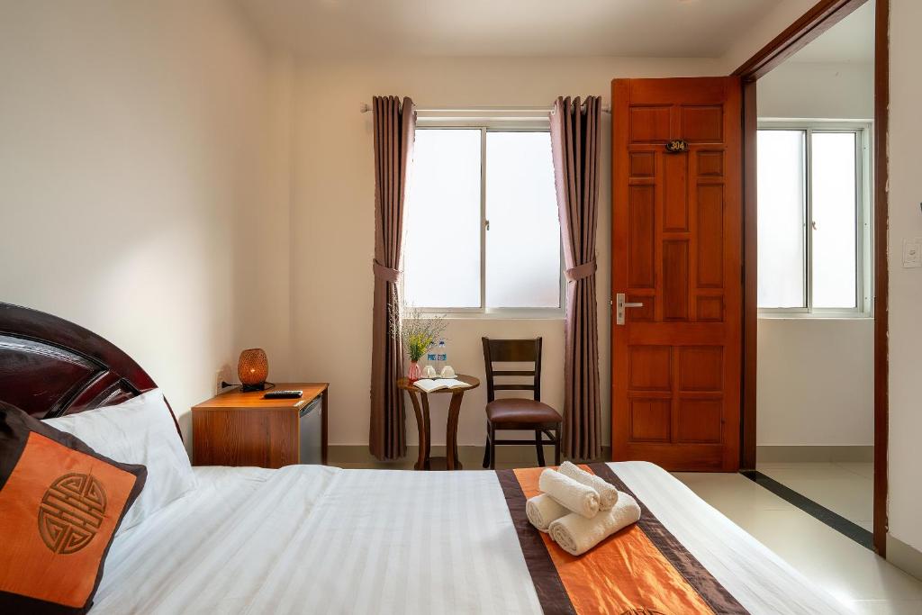 Postel nebo postele na pokoji v ubytování Sam Sam Homestay