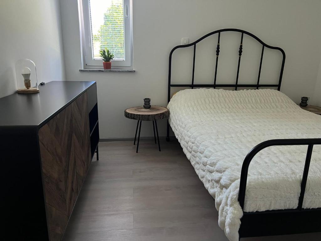 Postel nebo postele na pokoji v ubytování Apartma - Hiša Zofija