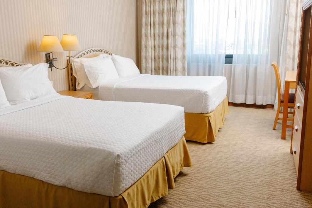 Postel nebo postele na pokoji v ubytování Intercity Tower Hotels