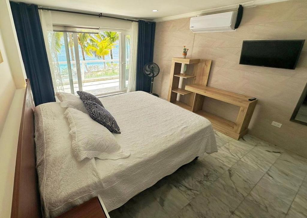 Postel nebo postele na pokoji v ubytování Exclusivos Apartamentos con playa privada