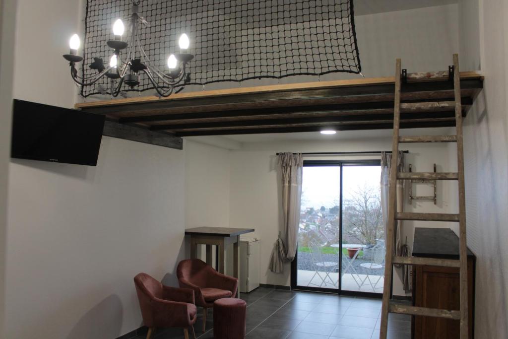 TV a/nebo společenská místnost v ubytování Chambre d'hôtes vue sur mer