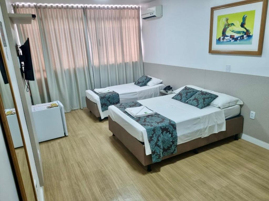Postel nebo postele na pokoji v ubytování Max Hotel