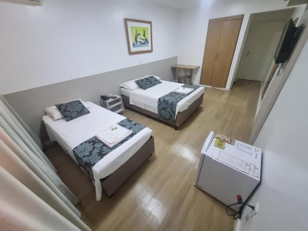 Postel nebo postele na pokoji v ubytování Max Hotel