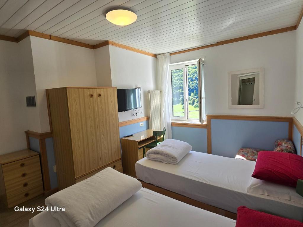 Postel nebo postele na pokoji v ubytování Hotel Miramonti