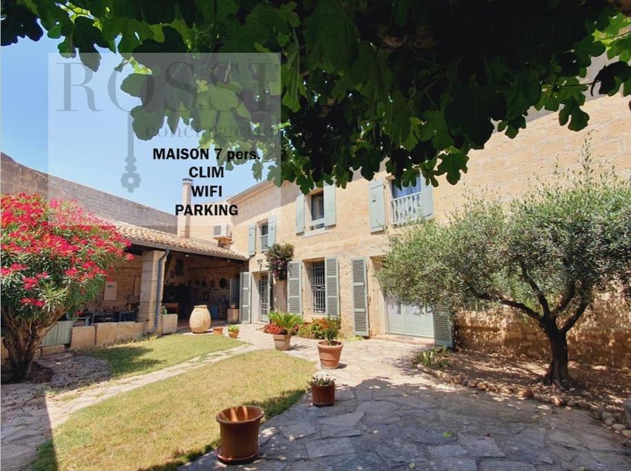 a building with a sign that reads macintosh fires camp wifi parking at Maison de Village en Camargue Parking Clim Wifi - ROSSIconciergerie - Linge inclus in Saint-Laurent-dʼAigouze