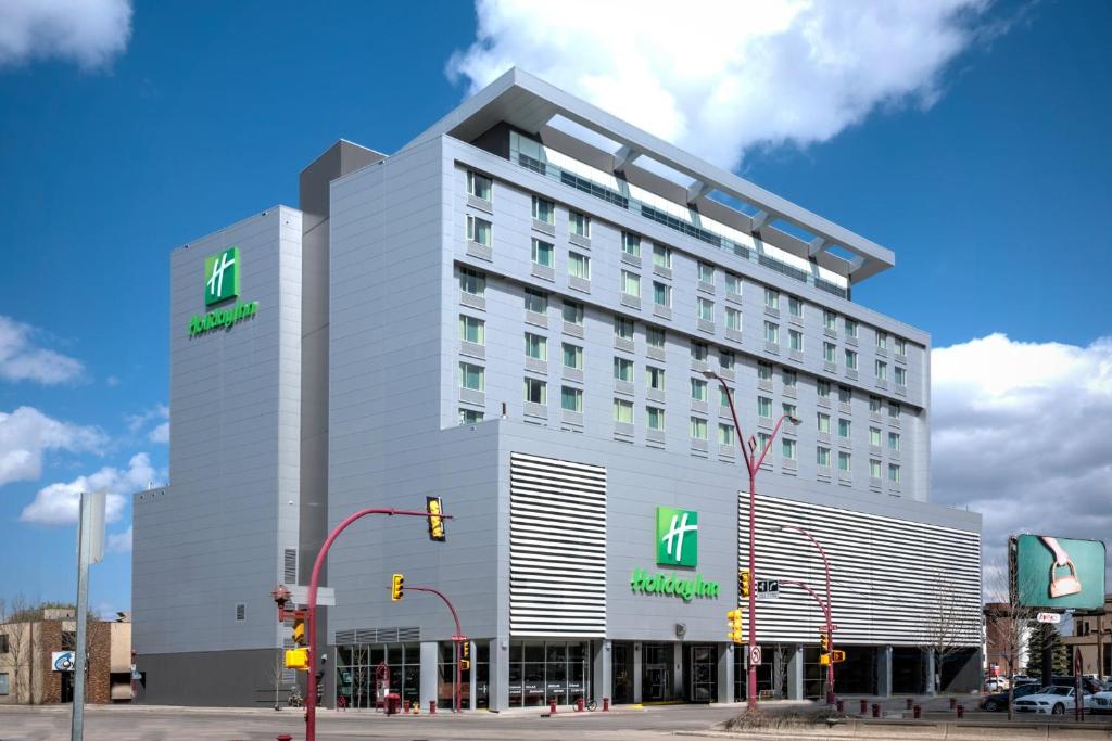 a rendering of a hotel building on a city street at Holiday Inn Saskatoon Downtown by IHG in Saskatoon