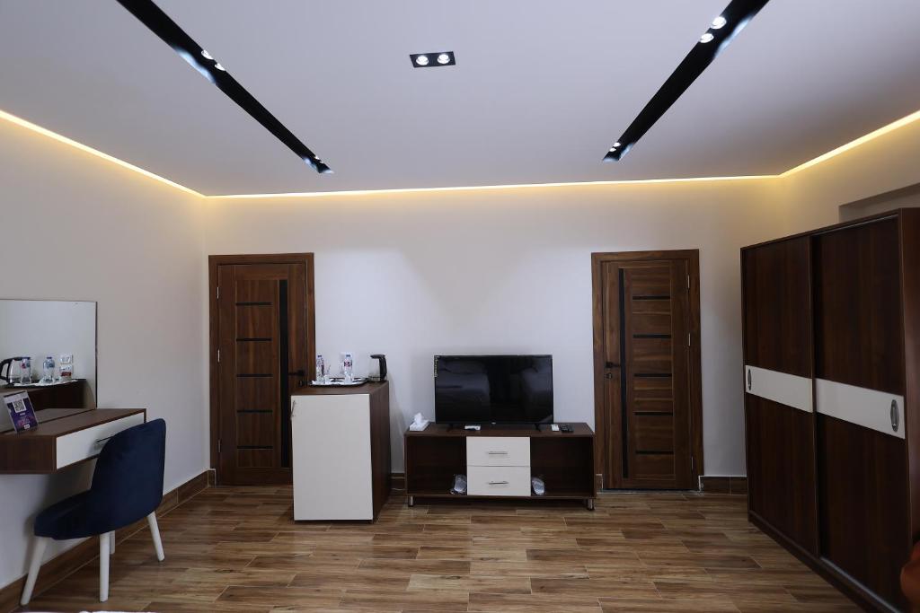 TV a/nebo společenská místnost v ubytování Pyramids Sunshine Hotel