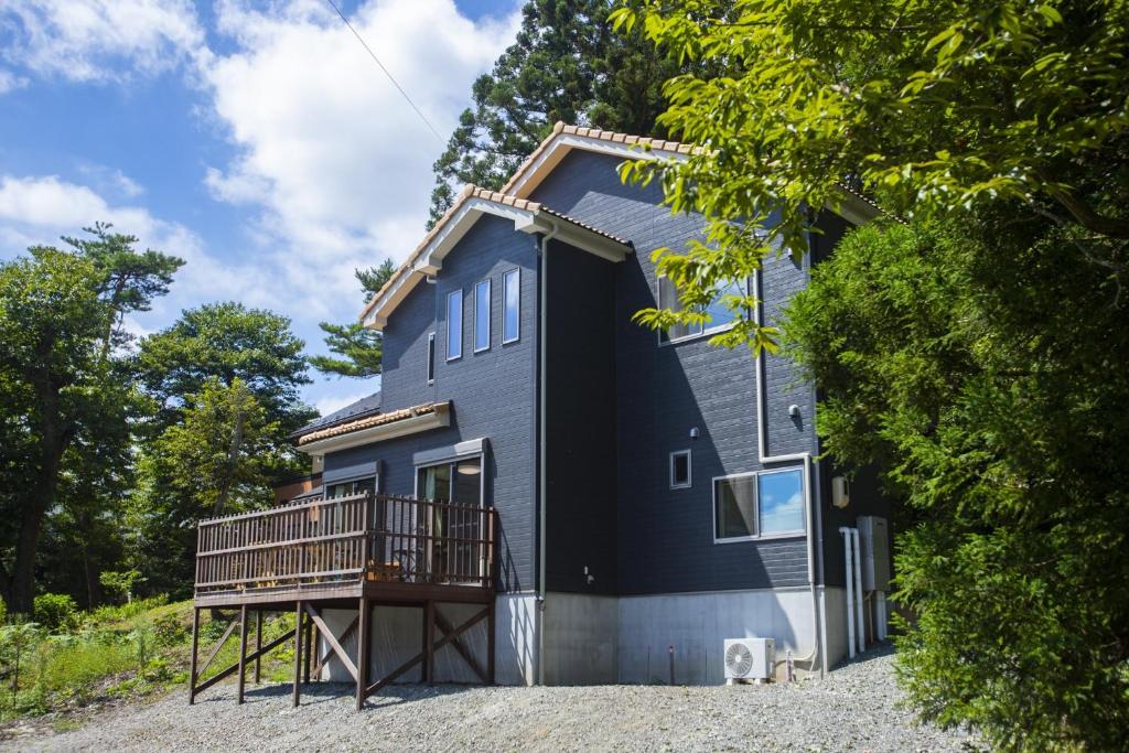a black house with a balcony on the side of it at - Villa du Soleil - Zao Sansuien - Gaia Resort - Vacation STAY 54225v in To-katta