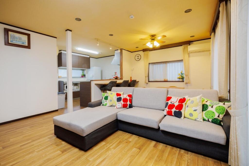 a living room with a couch and a kitchen at Shibatagun - House - Vacation STAY 17462 in Murata