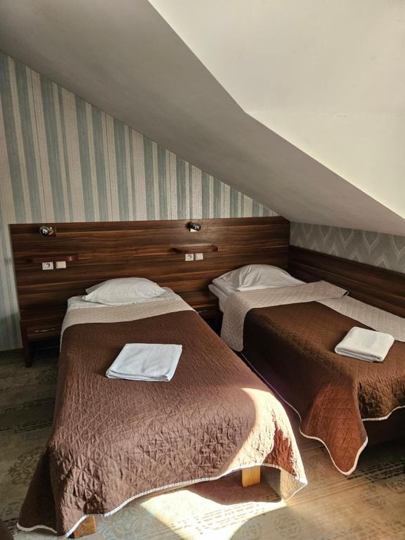Postel nebo postele na pokoji v ubytování Gościniec Jurajski